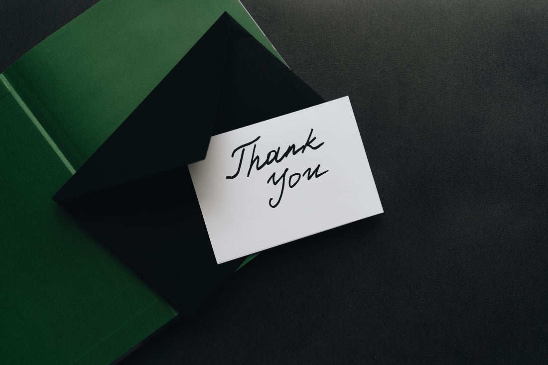 Minimalist thank you card with green envelope, perfect for expressing gratitude.